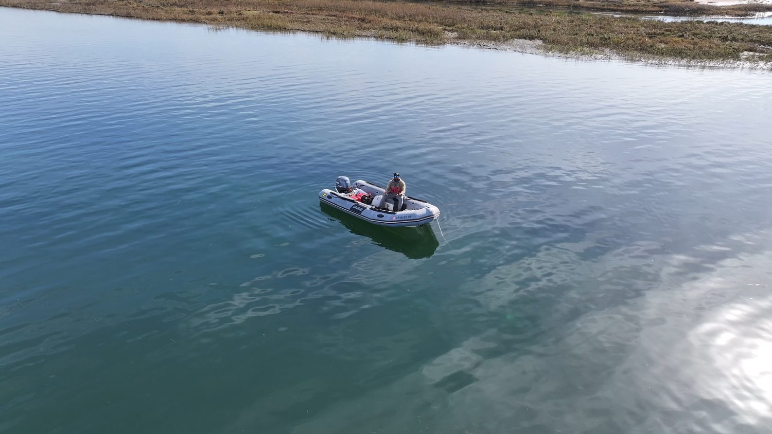 Drone view over calm coastal water