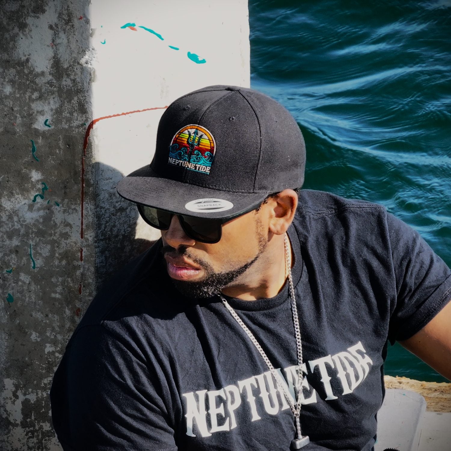Neptune's Legacy hat and shirt photo